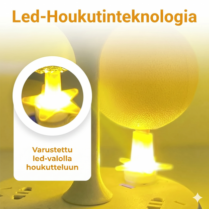 Tahmea hedelmäkärpäsansapallo jalustalla ja LED-valolla